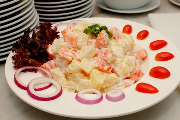  Potato salad in a bowl with plate