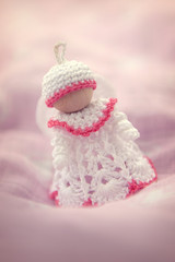 Obraz na płótnie Canvas Tiny handmade crochet angel decoration