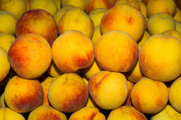 Juicy super fruit, ripe peaches at local fruit market bazaar