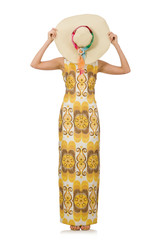 Young woman wearing hat and long summer dress isolated on white