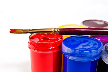 Bottles with gouache paints and brush for artistic paintings