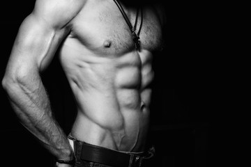 Muscular and sexy torso of young man. Black and white photo