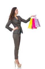 Attractive woman with shopping bags isolated on white