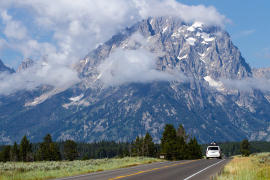 Car on the main road through Grand Teton National Park in Wyoming