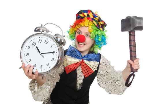 Female clown with alarm-clock and hammer isolated on white