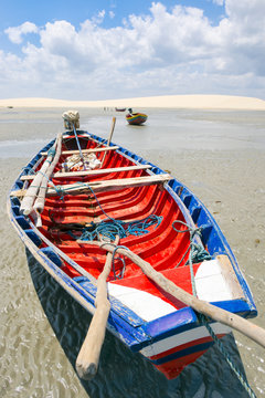 Traditional colorful Brazilian fishing boat on the beach in Jericoacoara Brazil