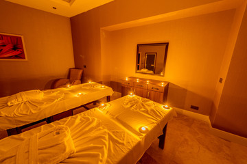 Spa room with burning candles