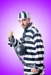 Fototapeta premium Convict criminal in striped uniform
