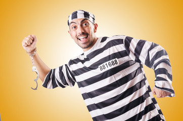 Convict criminal in striped uniform