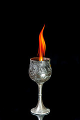 Wine goblet with Fire flames on black background