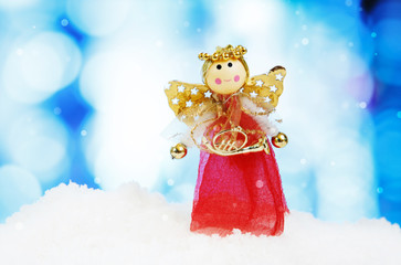 Angel and christmas decoration on abstract background and snowfl
