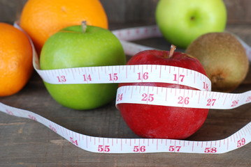 Green apple, Red apple. Fruit Diet concept on a wooden floor.
