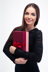 Woman in black dress holding gift box