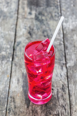 Red juice in a glass with ice