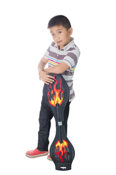 Asian boy holding a snakeboard, skateboard, isolated on white background