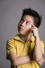 Asian boy thinking