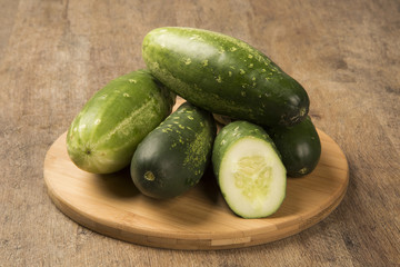 Fresh cucumber on the wooden table