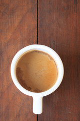 Coffee. Cup Of Coffee on brown desk