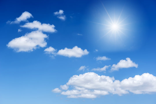 Blue sky and cloud with bright sun star flare background.
