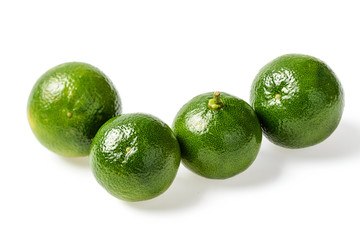 small green lime on white, tilt shift lens
