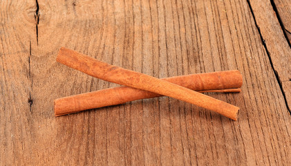 Cinnamon sticks on wooden table