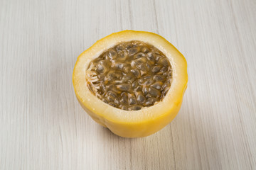 Close up of some passion fruits over a wooden surface seen from