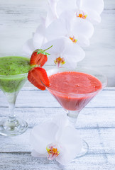 Fresh fruit and berry cocktail  on shabby wooden boards and whit