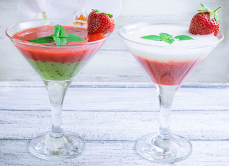 Fresh fruit and berry cocktail  on shabby wooden boards and whit