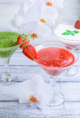 Fresh fruit and berry cocktail  on shabby wooden boards and whit