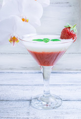 Fresh fruit and berry cocktail  on shabby wooden boards and whit