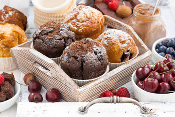 assortment of fresh delicious muffins and fresh berries 