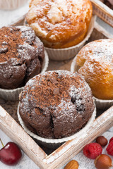 assortment of fresh delicious muffins and fresh berries 