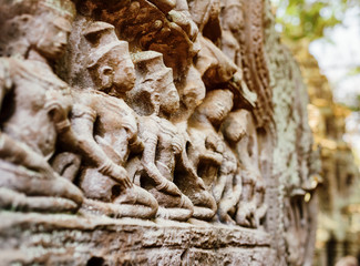 Bas-relief at ancient Ta Prohm temple in Angkor, Cambodia