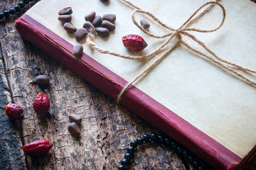 Corded book with beads, dogrose, pine nuts