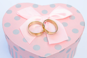 Wedding ring placed on a heart-shaped box
