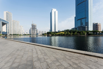 Modern skyline and empty road floor