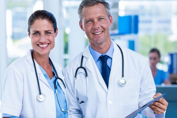 Fototapeta premium Happy doctors smiling at camera