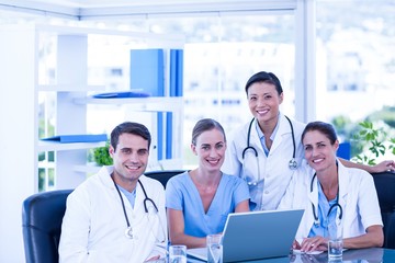 Team of doctors smiling at camera