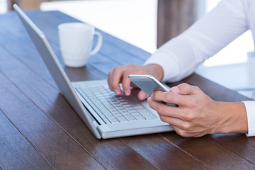 Fototapeta premium Close up view of a businessman typing on laptop
