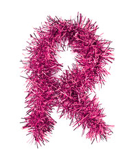 Tinsel Christmas decoration in form of letter R. On a white back