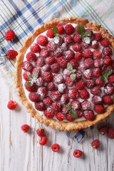Fresh raspberry tart with cream cheese closeup. vertical top view
