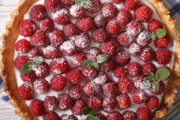 raspberry tart with whipped cream macro. horizontal top view
