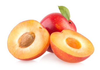 red plums on white background
