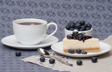 Cheese Cake With Blueberry Jam And Blueberries On White Plate