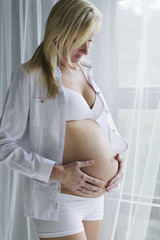 Young pregnant woman with her unborn child