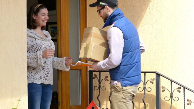 Courier Delivering a Package to a happy woman