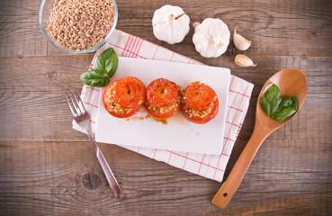 Stuffed tomatoes on a white plate. 