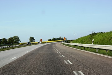 Fototapeta premium Swedish highway with warning sign for reindeer, elk