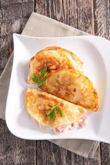 salad and crepe with cheese and ham