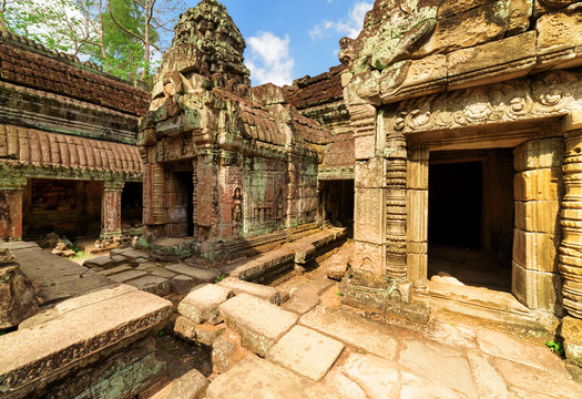 Mossy buildings with carving of ancient Preah Khan, Angkor